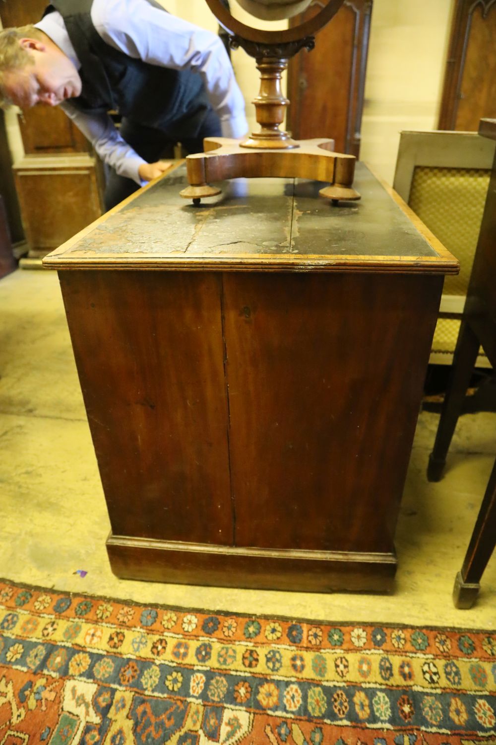 A George IV mahogany kneehole desk, with recessed cupboard, W.115cm, D.60cm, H.76cm